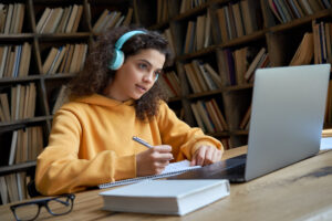 Student listening to an Accessible PDF with headphones